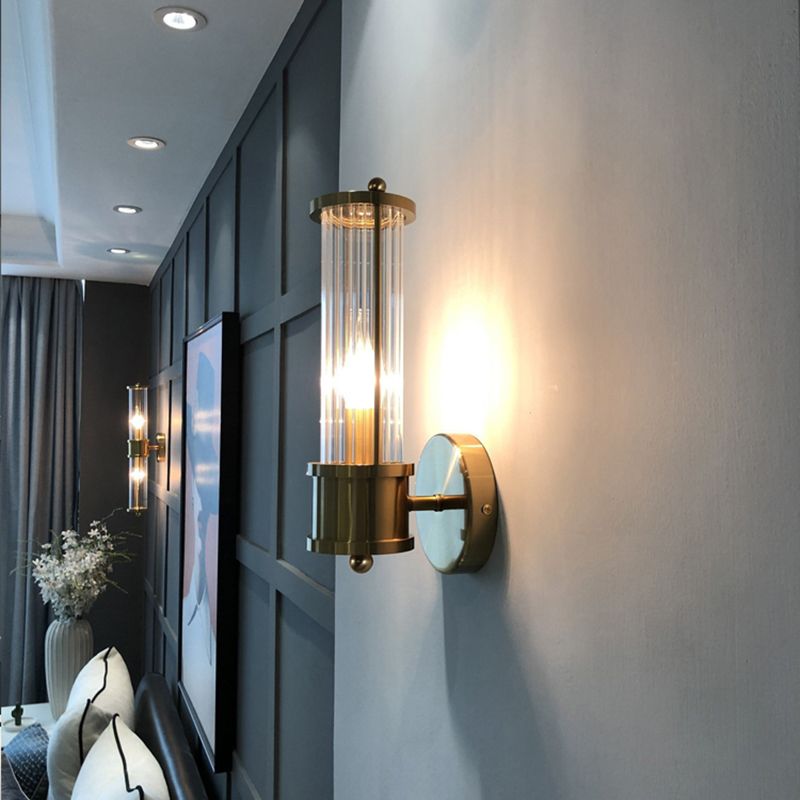 Kristy – Elegancka cylindryczna lampa ścienna w kolorze złotym ze szkła i metalu 4