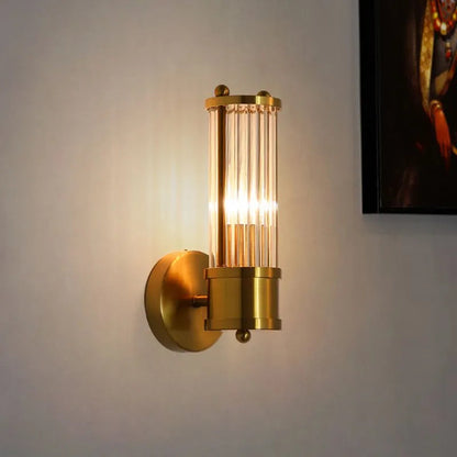 Kristy – Elegancka cylindryczna lampa ścienna w kolorze złotym ze szkła i metalu 7