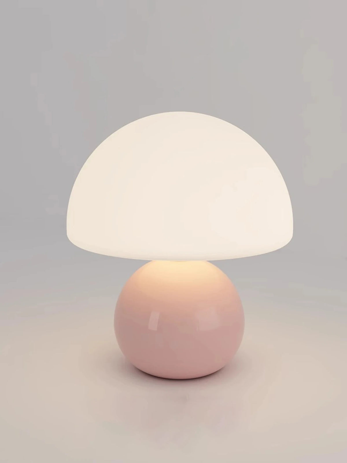 Nowoczesna lampa stołowa z kulistą podstawą i kloszem w kształcie grzybka – styl minimalistyczny