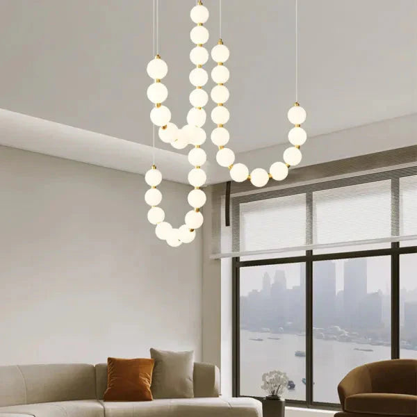 Lampa wisząca LED nowoczesna – efektowna forma naszyjnika z kulami świetlnymi